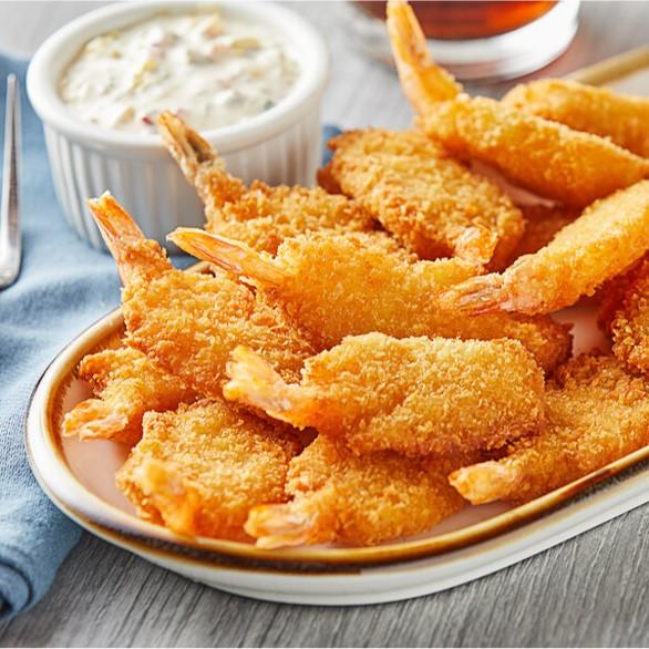 Puedes disfrutar nuestros exquisitos camarones apanados solos o acompañados de una salsa